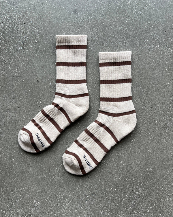 Pair of striped socks on a gray surface