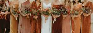 Annie's and Kelsey's bridesmaids with wedding flower arrangements in Denver
