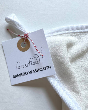 White bamboo washcloth with a 'fort&field' tag on a light background