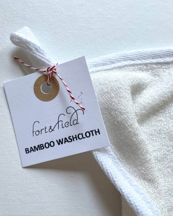 White bamboo washcloth with a 'fort&field' tag on a light background
