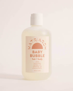 Bottle of Matriarch Baby Bubble hair and body wash on a light background