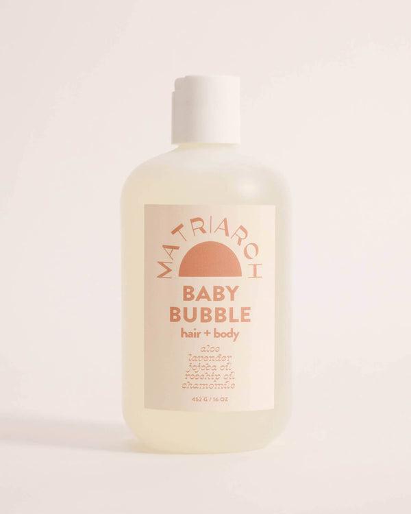 Bottle of Matriarch Baby Bubble hair and body wash on a light background