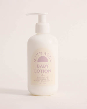 Baby lotion bottle with a brand logo on a light background