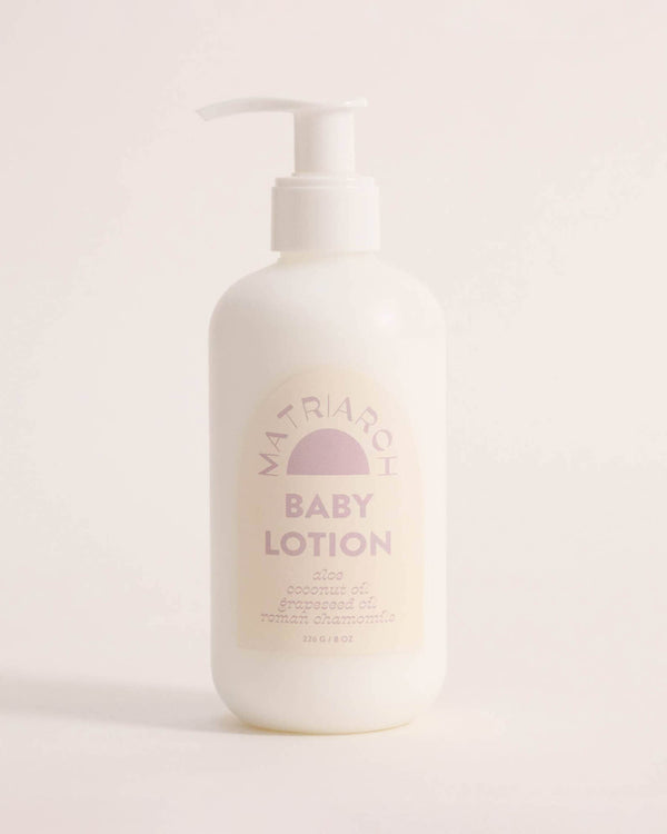 Baby lotion bottle with a brand logo on a light background