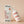 Wiley Baby lotion bottle and packaging on a beige background