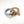 Wooden teething ring with an elephant cut-out and powder blue silicone beads on a white background