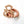 Wooden teething ring with a monkey cut-out and peach silicone beads on a white background