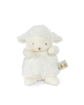 White plush lamb toy with a tag on a white background