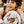 Child holding a plush bunny toy outdoors