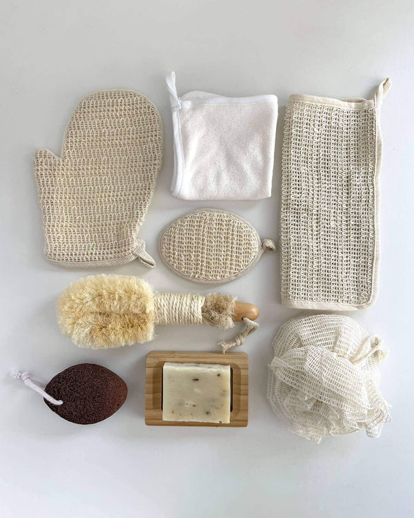 Collection of natural skincare tools and products on a white background