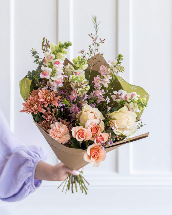 Classic bouquet in a Florist's Choice palette with garden roses, snapdragons, mums, and eucalyptus, designed by Landfall Floral Co.