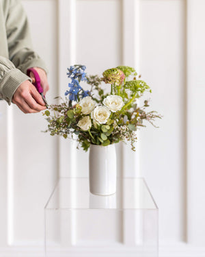 Petite Darling flower arrangement in a white vase with soft seasonal blooms – Landfall Floral Co., Denver.