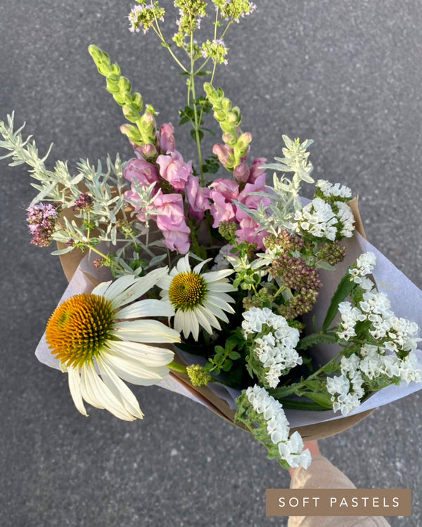 Darling Bouquet in the Soft Pastels palette with white coneflowers, soft lavender snapdragons, and delicate greenery in a petite kraft wrap.