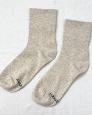 Pair of light gray socks on a white background