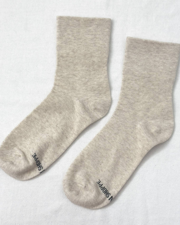 Pair of light gray socks on a white background