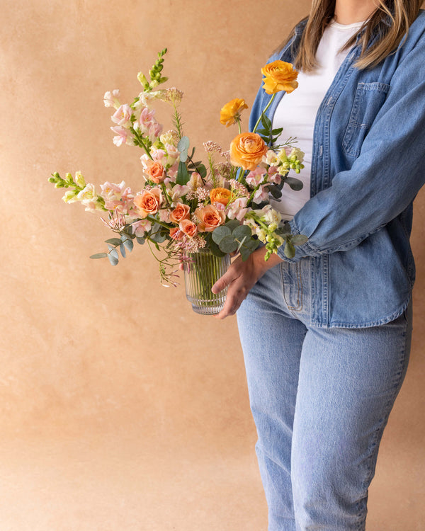 Person holding Mother's Day Signature Arrangement for scale — Landfall Floral Co.
