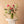 Mother's Day Classic Arrangement displayed on a pedestal — full, garden-style flower arrangement in a tall glass vase, Landfall Floral Co.
