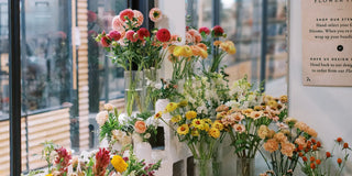 Colorful seasonal flowers displayed at the stem bar inside Landfall Floral Co.'s Denver-area flower shop.