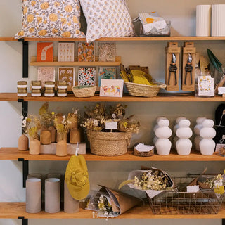Curated gifts, handmade ceramics, dried flowers, and home goods on display at Landfall Floral Co. in Edgewater, Colorado.