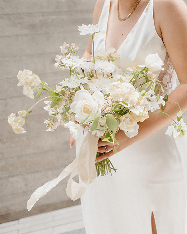 Seasonal elopement bridal bouquet in a contemporary white palette, designed with airy, organic florals.