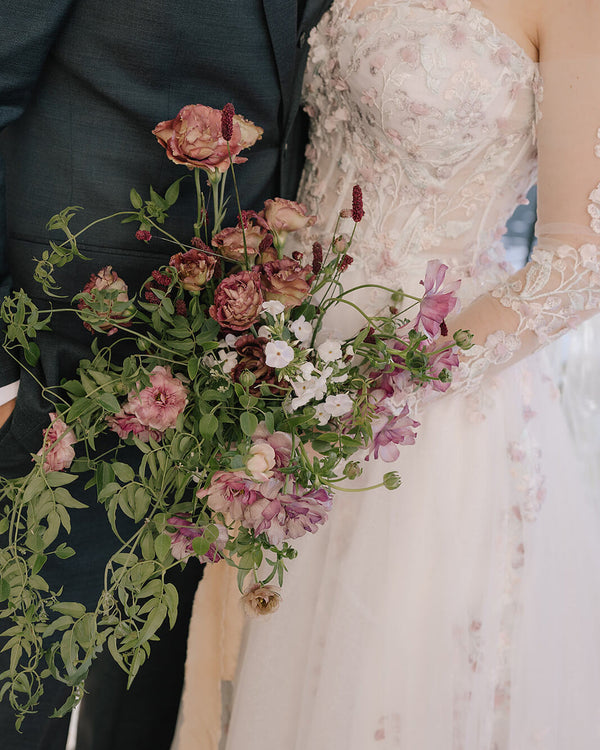 Earthy and elegant bridal bouquet designed with seasonal florals in warm, grounded tones.