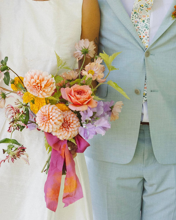 À la carte bridal bouquet in a playful color palette, featuring vibrant seasonal blooms and natural texture.