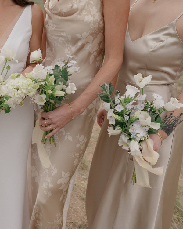 Soft pastel posy bouquets designed for an intimate wedding, featuring delicate seasonal flowers in a loose arrangement.