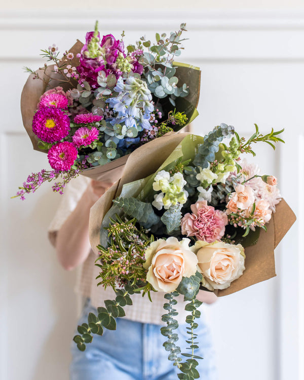 Group of Landfall bouquets in mixed color palettes, showing the Darling, Signature, and Classic bouquet sizes in an airy, elevated style.