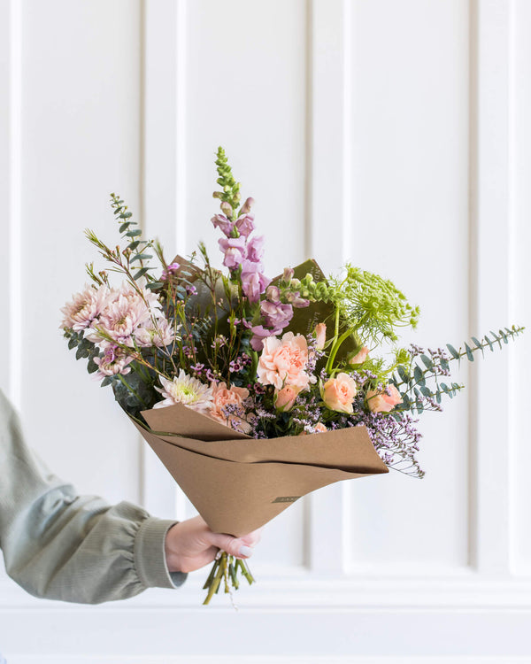 Signature Bouquet in a soft pastel palette with airy movement and unique flowers arranged in Landfall’s elevated style.