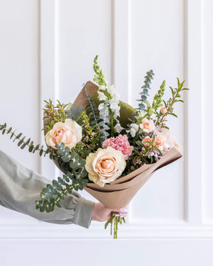 Signature Bouquet in a blush palette with airy movement and premium flowers, arranged in Landfall’s natural, elevated style.